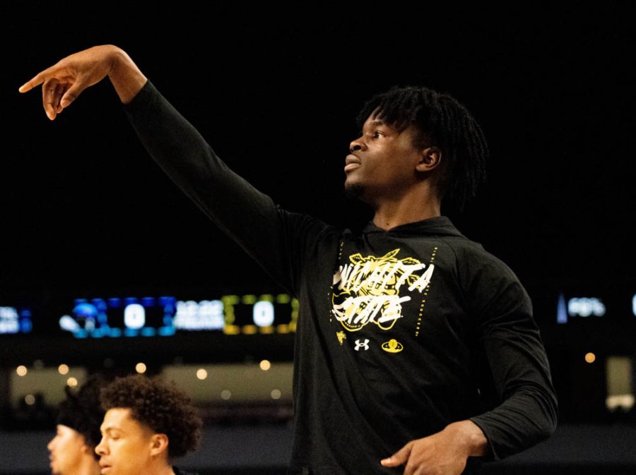 Freshman Isaac Abidde shoots a three during warmup before the Quarterfinals game against Tulane on March 10. at Dickies Arena in Fort Worth. The Shockers lost to Tulane in the Quarterfinals of the ACC tournament with a score of 76 to 82