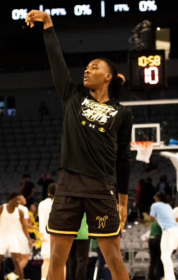 Sophomore Jaron Pierre Jr. practices his shots during warmups before the Quarterfinals game against Tulane in the AAC tournament on March 10. at Dickies Arena. Pierre Jr. made a total of 12 points during the Quarterfinals game.