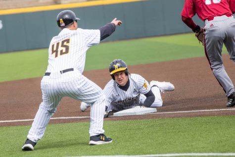 Infielder Jack Little slides to third base on March 26 when the Shockers play UMass and won 14-2. Little had three runs batted in during the three game series with UMass.