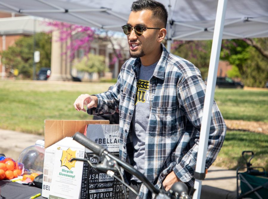 Ron Lam, the talent acquisition specialist at WSU Tech, encourages people to sign up for a bicycle giveaway. He helped host a booth with information about the school on April 16.