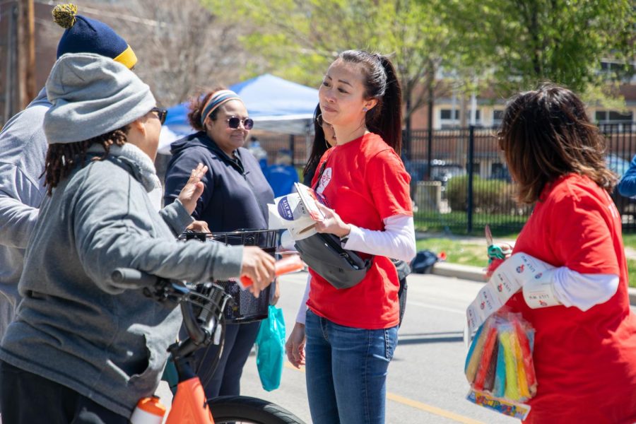 Journalist and mayoral candidate Lily Wu listens to a woman at the ICT Open Streets event on April 16.
