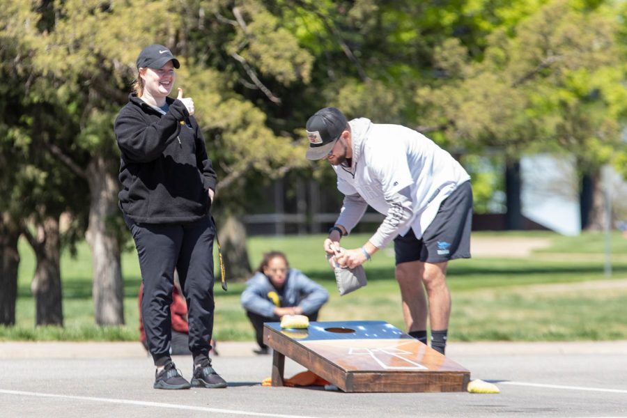 The Physical Education Program Coordinator, Olivia Butler, plays a match versus Daniel Mies, Vice President of PE Club. Butler helped run the Cornhole Tournament on Saturday.