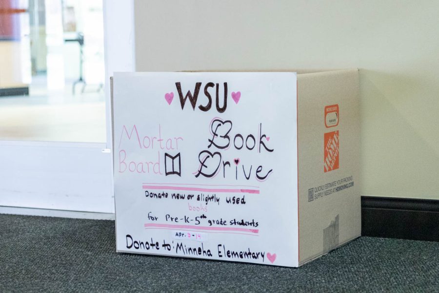Located in the East entrance of the Rhatigan Student Center is the collection box for the box drive. All collected books are being donated to Minneha Elementary School.