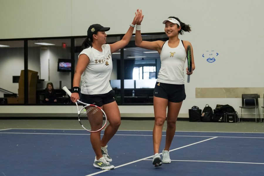LingWei Kong and Natsumi Kurahashi celebrates after a point during their set against Omaha at Gensis Rock Road on Mar. 26.