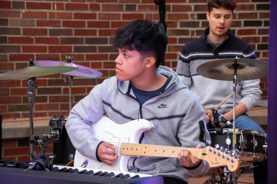 Sigma Alpha Epsilon member Nano Hernandez plays guitar during his final performance at Paddypalooza on April 24. He played with fellow fraternity members.
