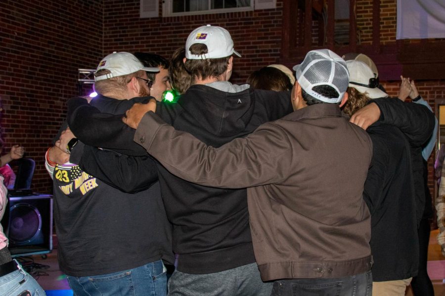 Sigma Alpha Epsilon brothers come together for a huddle after Paddypalooza. The night concluded with all attendees forming a circle and swaying to Piano Man, - a long standing SAE tradition.