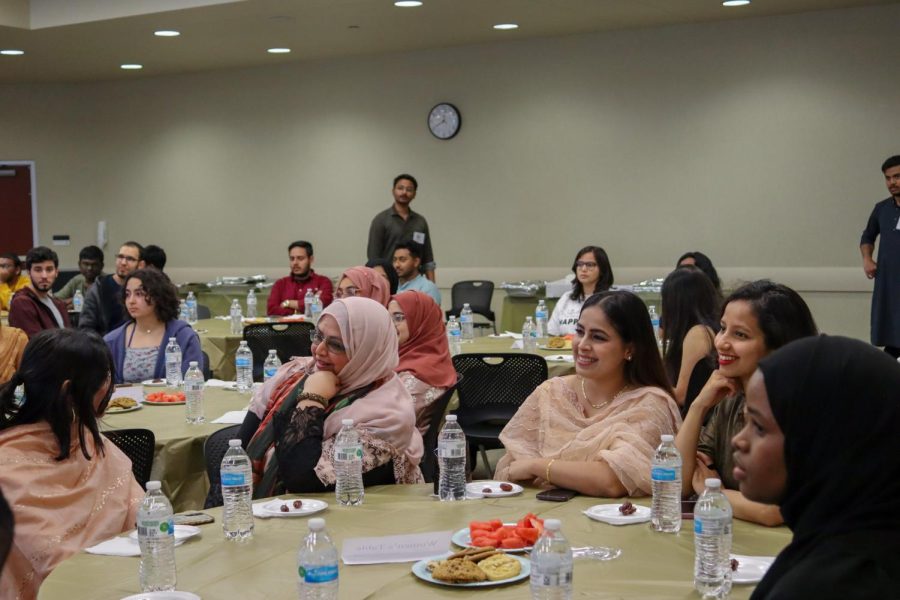 Members of the Muslim Students Association eat and laugh together at the Ramadan Iftaar Banquet on April 17. The event was open to any and all.