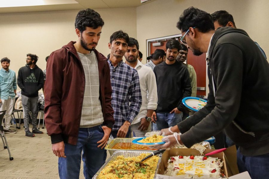 To break their fast, Muslim Students Association members and attendees get food at the Ramadan Iftaar Banquet.