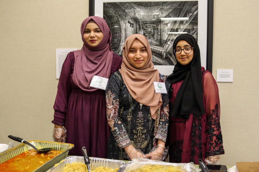 Ruqia Arabia, Areeba Mohiuddin, and another Muslim Students Association member pose for a photo at the Ramadan Iftaar Banquet on April 17.