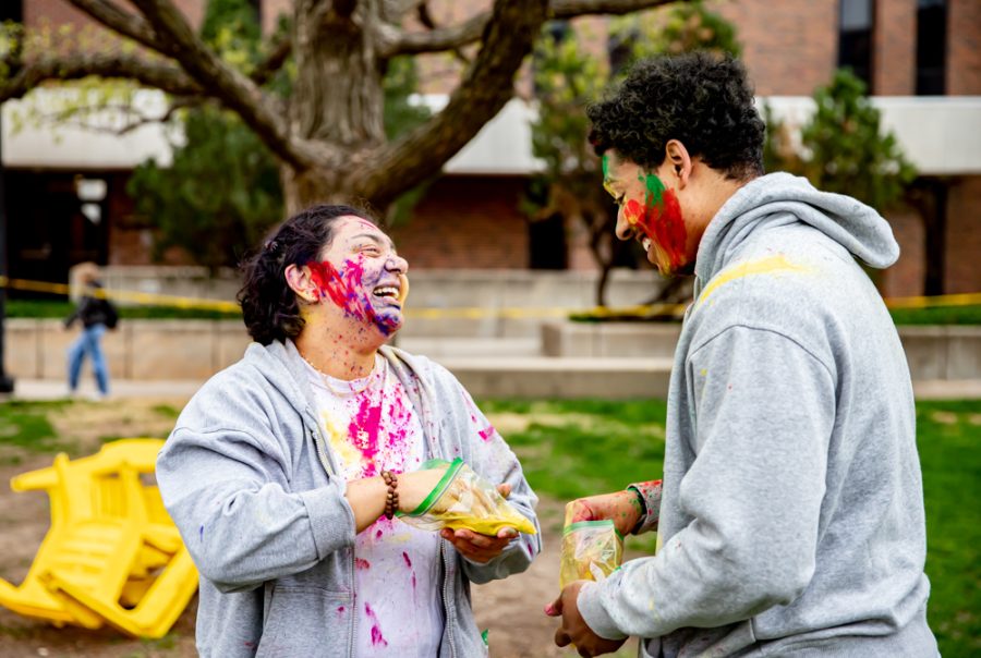 A pair of Holi participants coat each other in colored powder on April 15. Holi, also known as the Festival of Colors, is celebrated in several southeastern Asian countries.