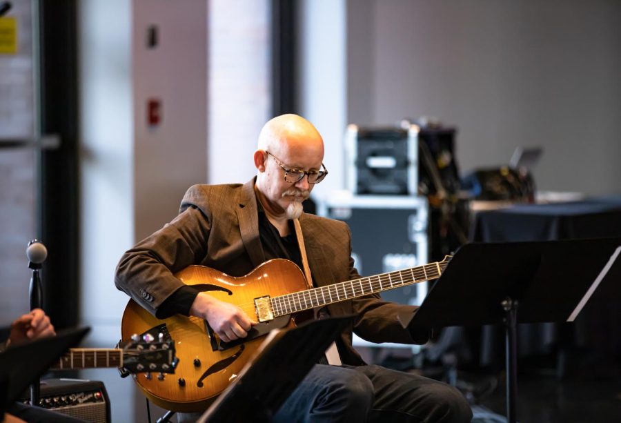 Randy Zellers plays guitar at the Wichita Art Museum on April 20. Zellers teaches multiple jazz courses at Friends University.