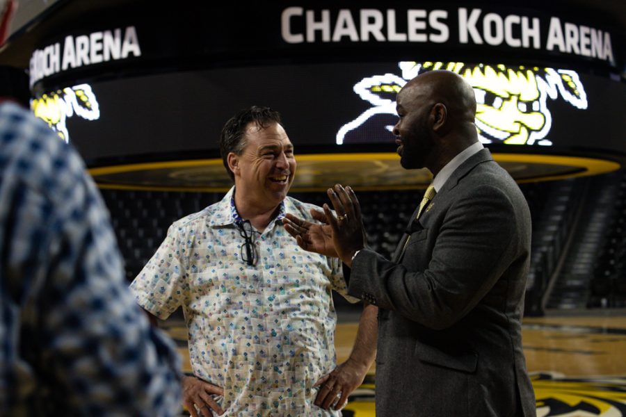 Volleyball coach Chris Lamb talks with new head womens basketball coach, Terry Nooner, at the press conference held on April 20 at Charles Koch Arena.