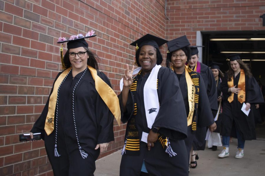 Graduates get ready to walk inside Charles Koch Arena for a 9 a.m. ceremony on May 13.