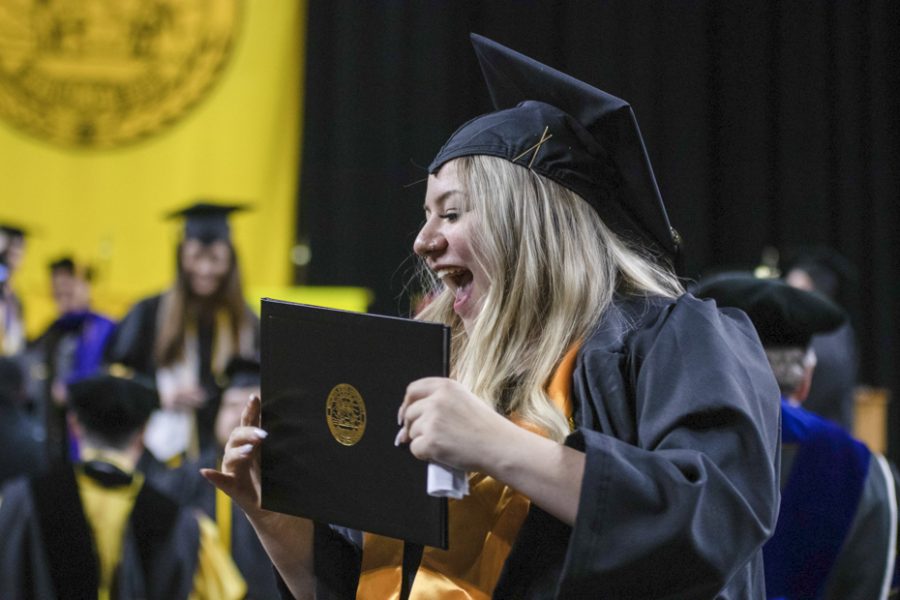 Wichita State graduate participates in the liberal arts and sciences and fine arts graduation on May 13.