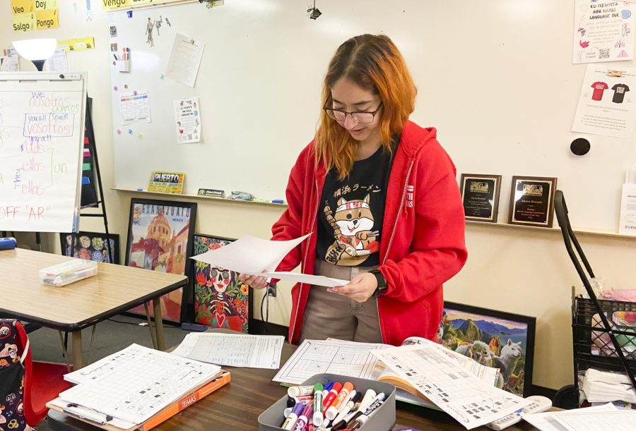 Alondra Aguilera sorts through papers at North High. Aguilera student-taught for Spanish teacher Alyssa Rumple.