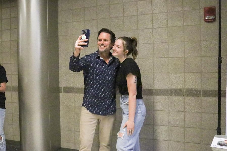 Actor and musician Charles Esten poses for a photo with a fan after the game between the Wichita SkyKings and the Little Rock Lightning. Esten as well as basketball pros were invited to the game for the SkyKings first FanFest.