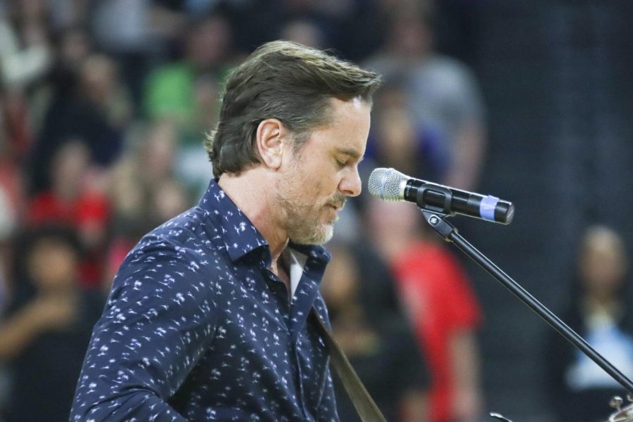Actor and musician Charles Esten sings the national anthem before the start of the game between the Wichita SkyKings and the Little Rock Lightning. Esten as well as basketball pros were invited to the game to meet with fans.