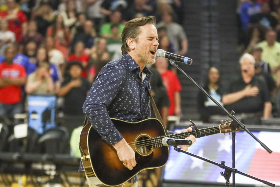 Actor and musician Charles Esten sings the national anthem before the start of the game between the Wichita SkyKings and the Little Rock Lightning. Esten as well as basketball pros were invited to the game to meet with fans.
