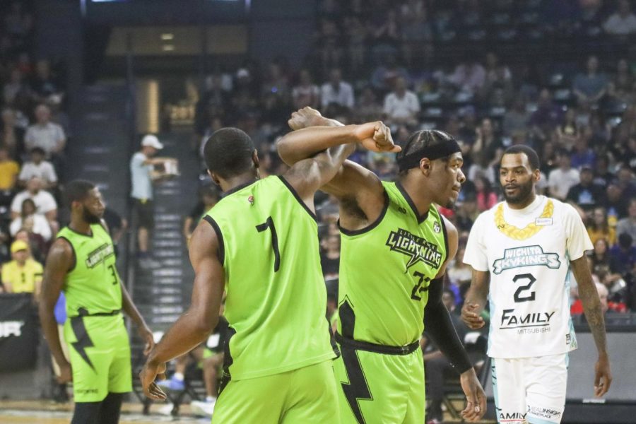 Little Rock Lightning players lock arms after a successful play against the Wichita SkyKings in Charles Koch Arena on May 28.