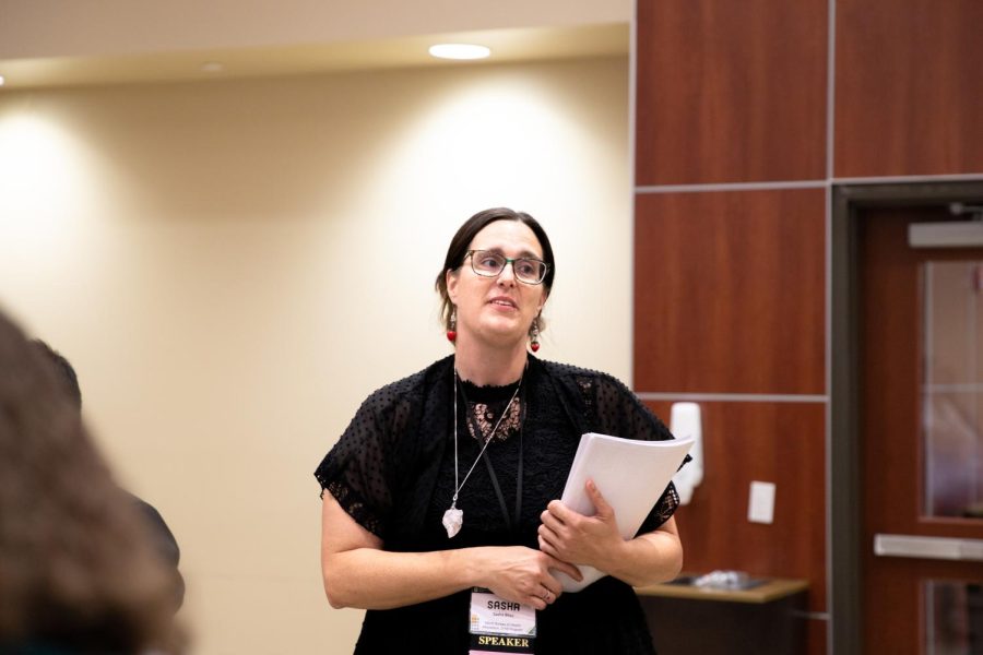 Sasha Bliss from the Kansas Department of Health and Environment Bureau speaks at the eighth annual Kansas Community Health Worker Symposium on June 15.