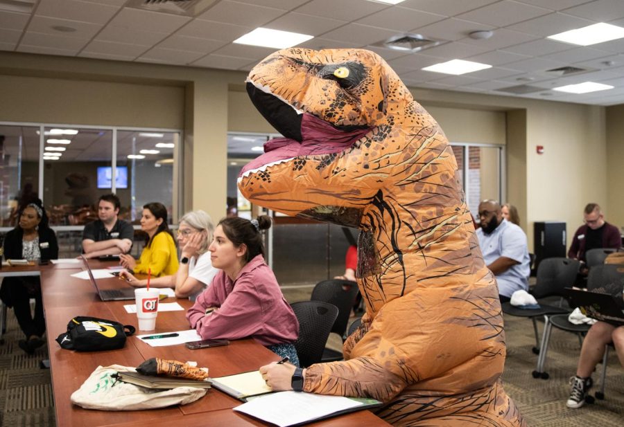 Sara Rue in a dinosaur costume at the Staff Senate meeting on June 20.