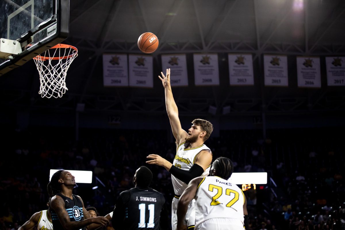 AfterShocks center Asbjorn Midtgaard goes for a layup during the game against the B1 Ballers on July 20 inside Charles Koch Arena. The AfterShocks won, 66-54.