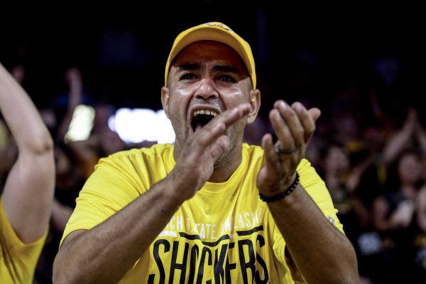 An AfterShocks fan cheers after a successful play by the WSU alumni team on July 25. The night brought out a record number of fans for The Basketball Tournament.