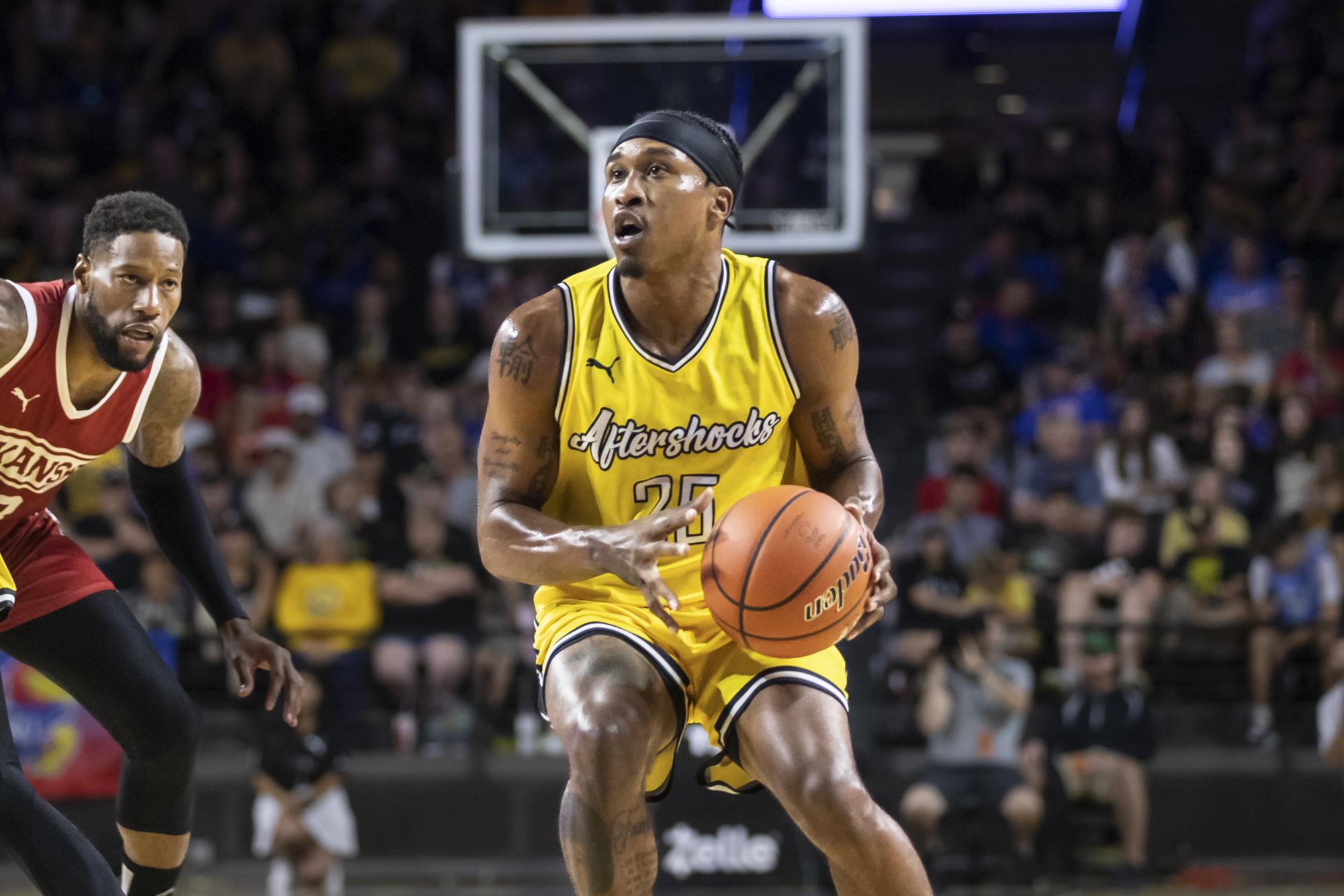 AfterShocks point guard Tyrus McGee looks to shoot during the game against Team Arkansas on July 23. The AfterShocks won, 63-59.