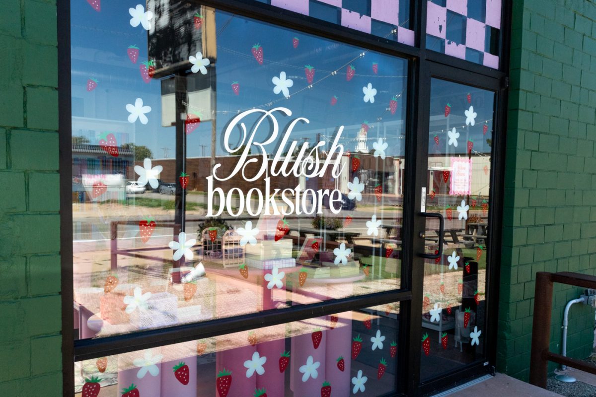 The bookstores front entrance, located on Cleveland street. Blush is neighbored by Violas Pantry and The Workroom.