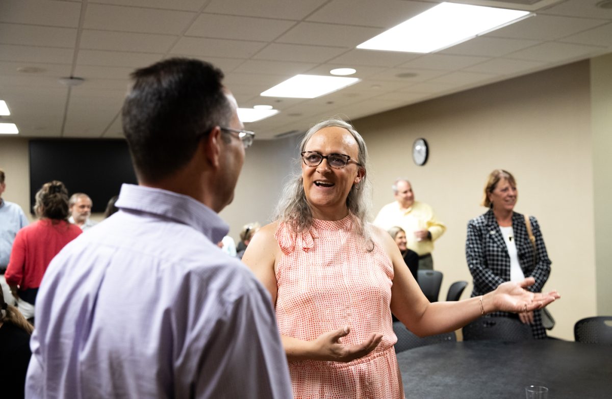 Anna Porcaro, executive director of Online and Adult Learning, talks with colleagues at her farewell party on Aug. 22. Porcaro joined WSU in 2010 as an instructional designer before moving to her current role.