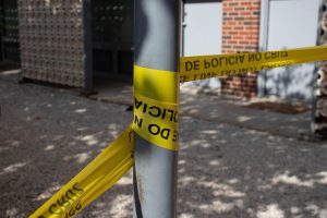 Caution tape at the 3900 East 17th Street N apartment complex on Aug. 26. File photo