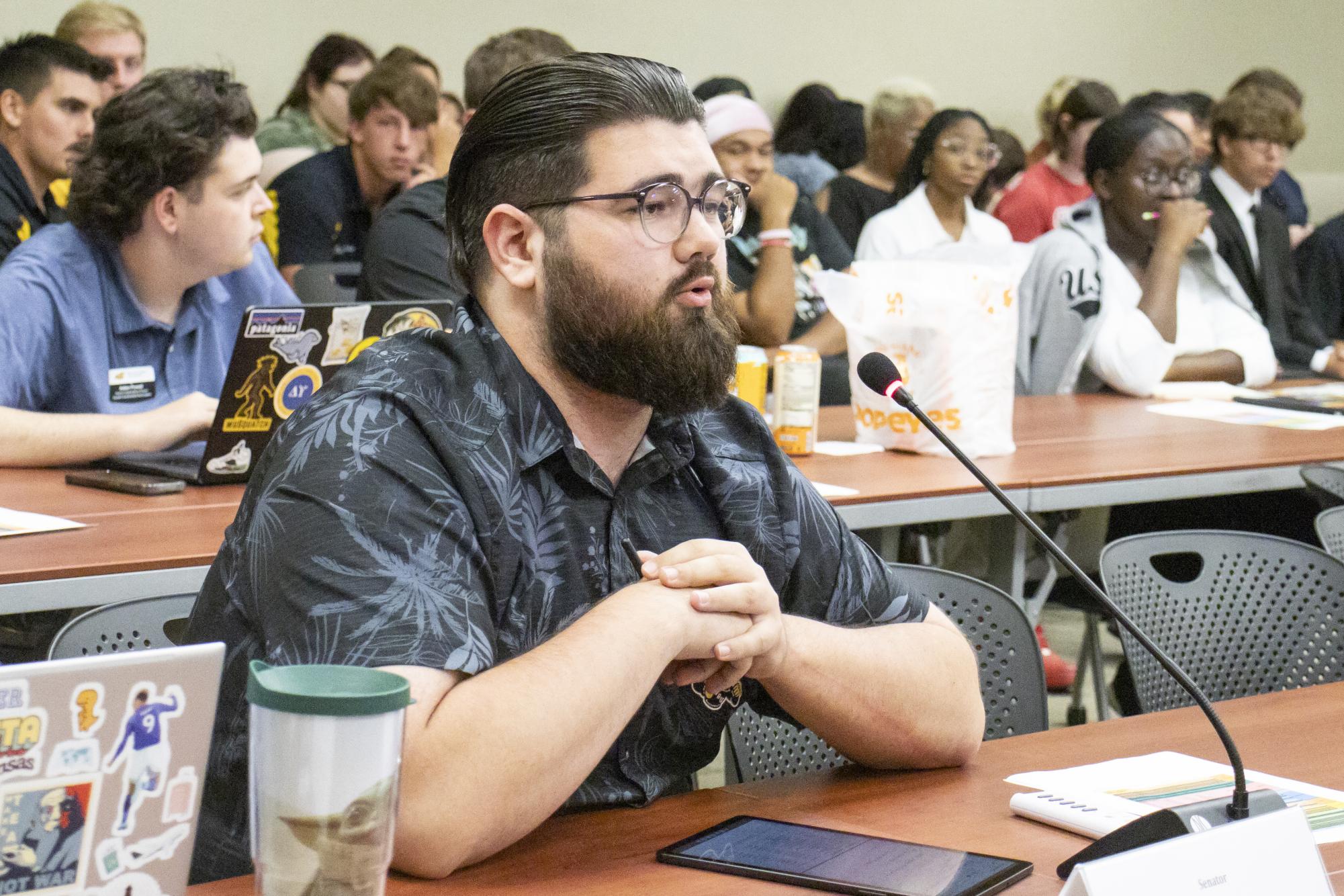 Jonathan Stanger asks a student a question during public forum on Aug. 30s Senate meeting. Stanger served as at-large Senator before leaving Student Government Association.
