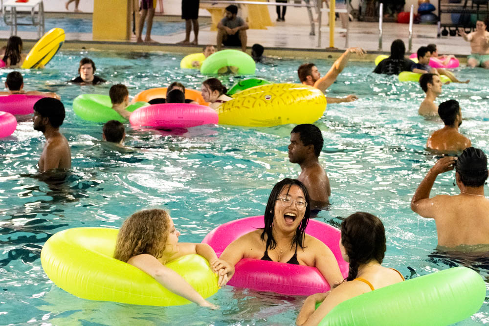 Enrish Patdu laughs while swimming at the Beach Party event. Campus Recreation hosted the event in the Heskett Center where students were able to swim and hang out in their eight-lane pool on Aug. 23. 