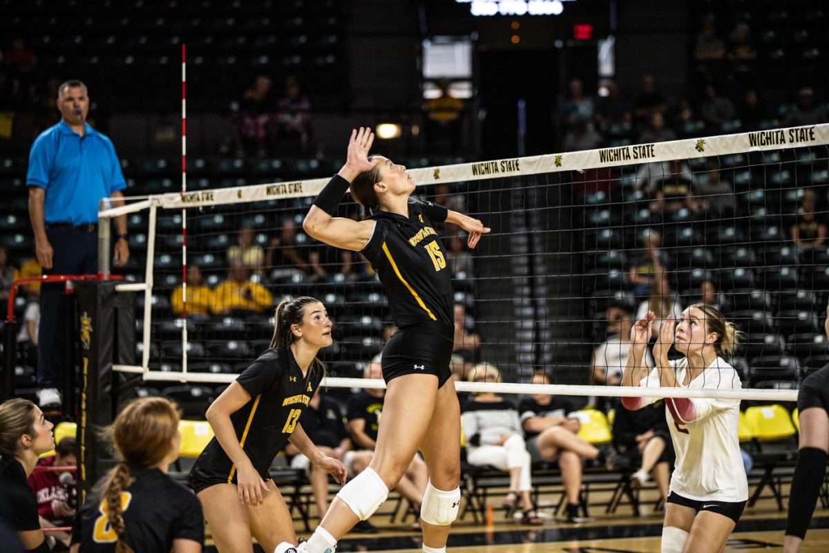 Redshirt Junior Morgan Stout dominates by the net with a stellar spike against OU at Charles Koch Arena, Aug 17, 2023.