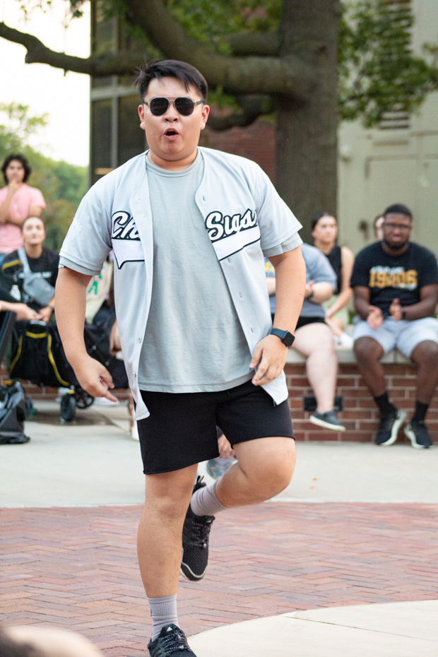 Danny Le starts the stroll for the Chi Sigma Tau fraternity.