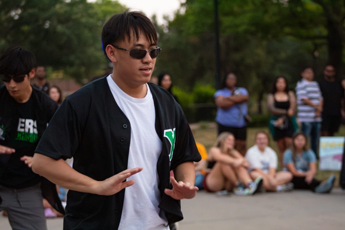 Huy Ho shows off his dance moves in the stroll. Ho is part of Chi Sigma Tau, and performed at the Yard Show on Aug. 29.
