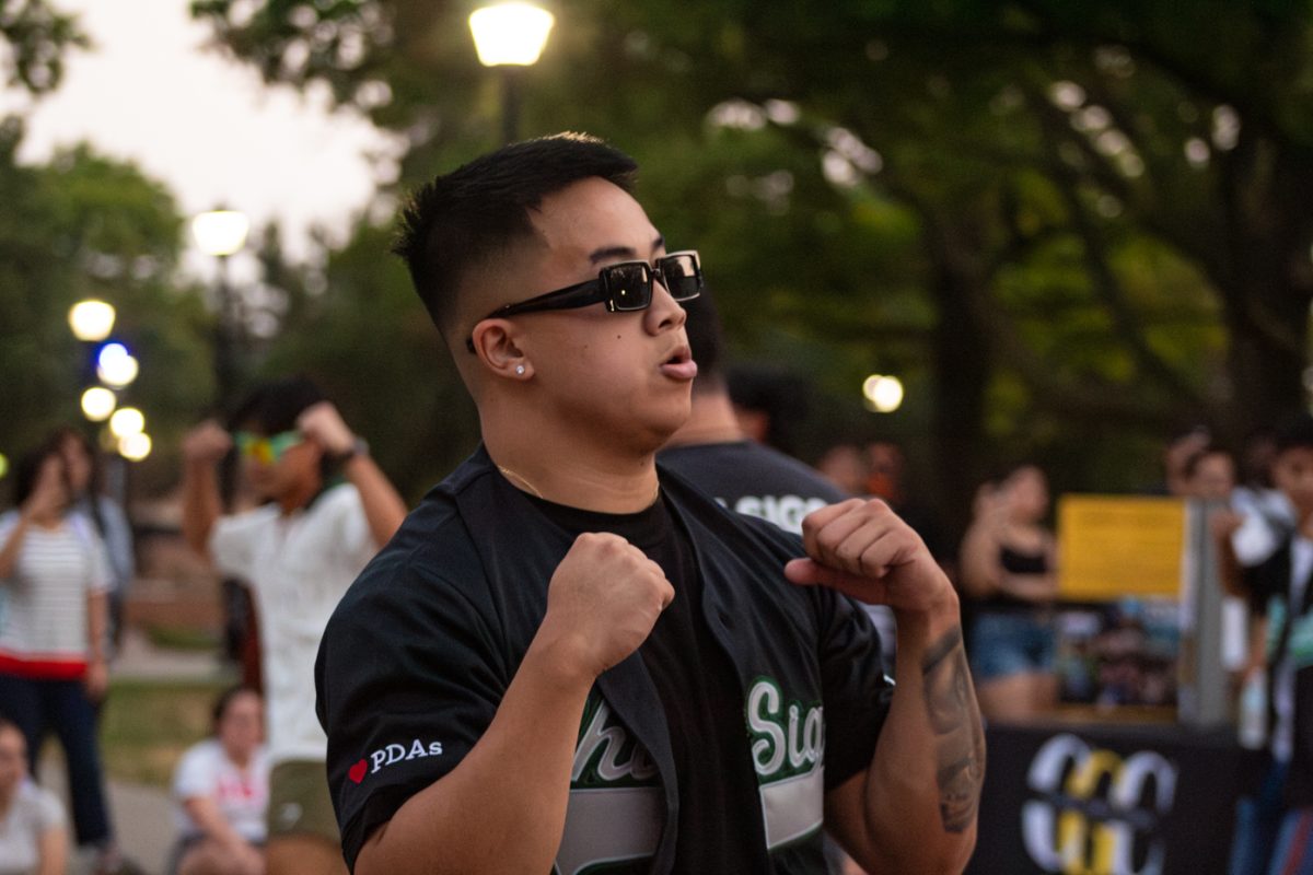 Darren Nguyen strolls with his fraternity brothers. He is part of Chi Sigma Tau, one of the fraternities that performed at the Yard Show.