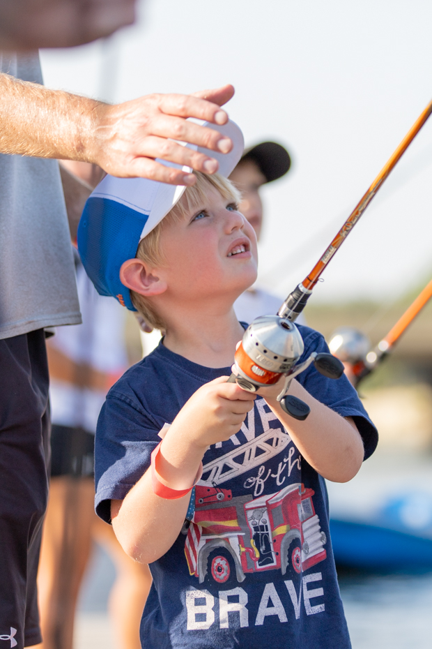 John goes fishing with his dad and brother at the Smores and Oars event on Aug. 30.
