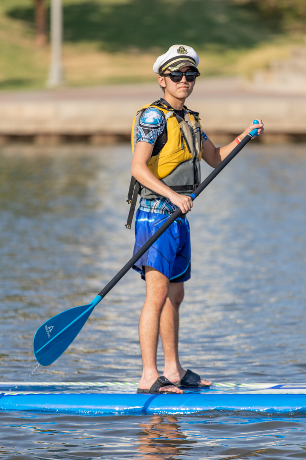 Raymond Tollison, a former graduate student at Baker University, paddle boards during the Smores and Oars event. The event was hosted at Boats and Bikes, where Shocker Rowing practices.