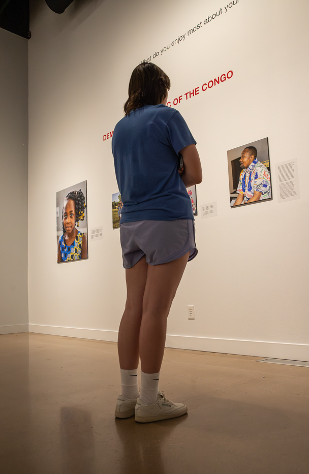 An attendee browses the fall 2023 exhibits at the Ulrich Museum on Aug. 24.