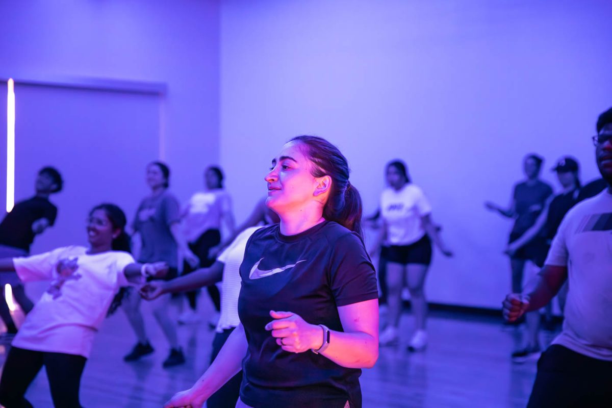 Attendees dance during the Zumba Night event on Aug. 17 in the Steve Clark YMCA. The event was hosted in association with Lambda Pi Upsilon Sorority, Latinas Poderosas Unidas, Inc and the Hispanic American Leadership Organization.