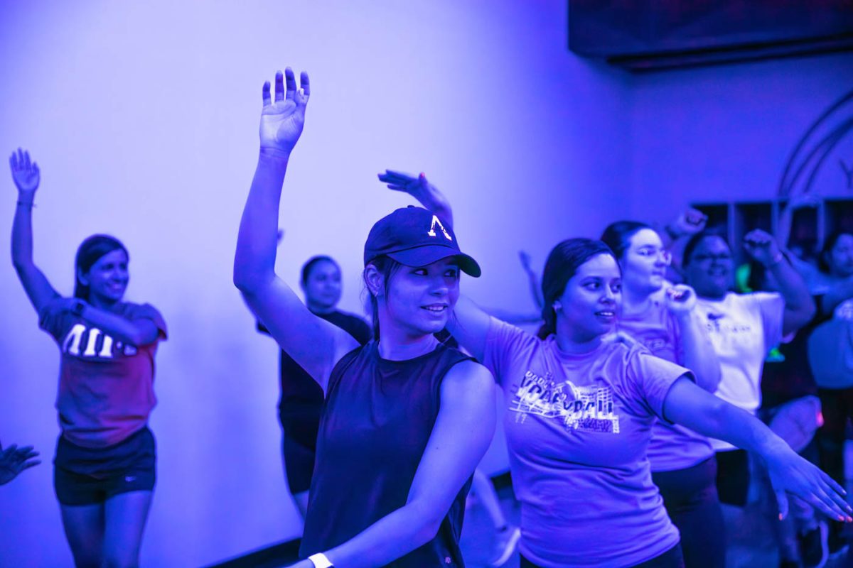 Attendees dance during the Zumba Night event on Aug. 17 in the Steve Clark YMCA. The event was hosted in association with Lambda Pi Upsilon Sorority, Latinas Poderosas Unidas, Inc and the Hispanic American Leadership Organization.