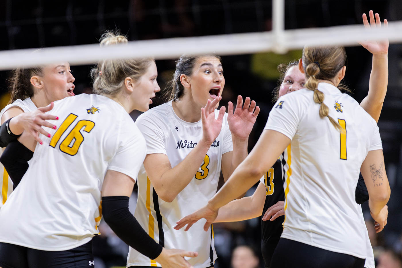 The Wichita State Shockers celebrate after scoring a point in the first set. Wichita State took the set 25-14.