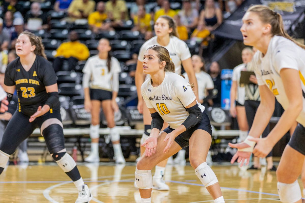 Players get set up to recieve the ball during the match against the University of Colorado. This matchup was the last of three during the Shocker Volleyball Classic.