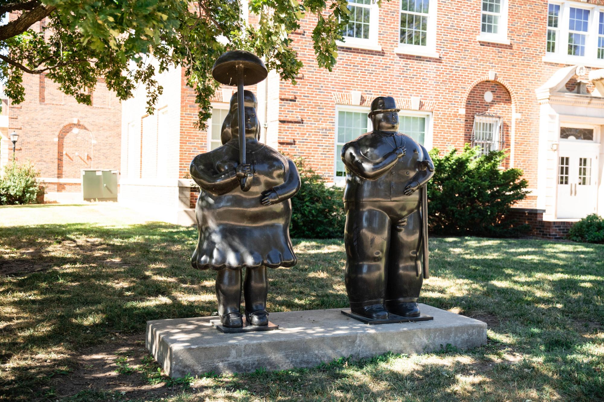 Fernando Boteros statues, Woman with Umbrella and Man With Cane, stand outside Jardine Hall. Botero died on Sept. 15 at age 91. 