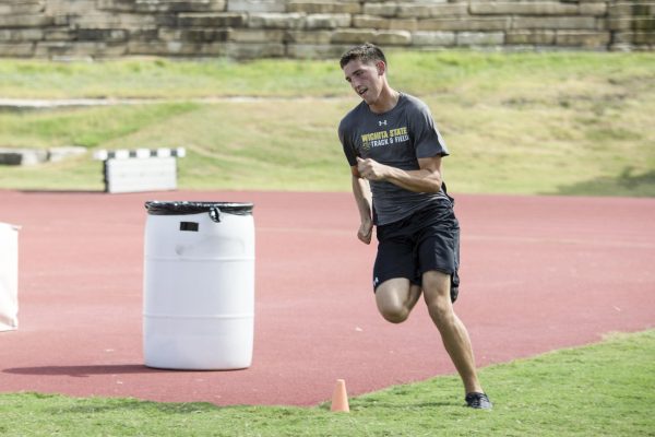 High jumper Brady Palen warms up on the track as track and field practice begins. Palen is a junior at Wichita State.