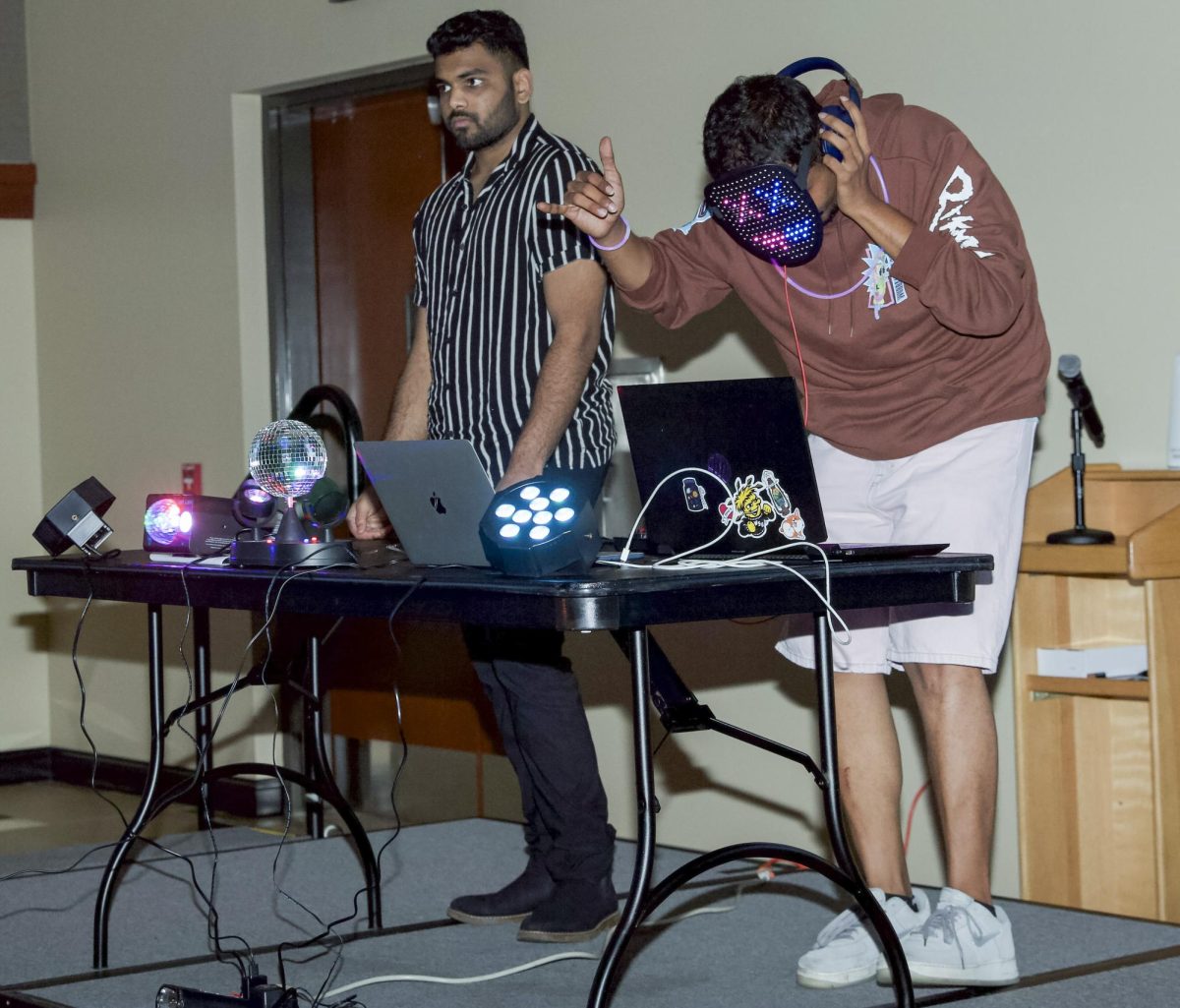 The DJ for Bollywood Night selects songs for students and members of the Association of Hindu Students In America to dance to.