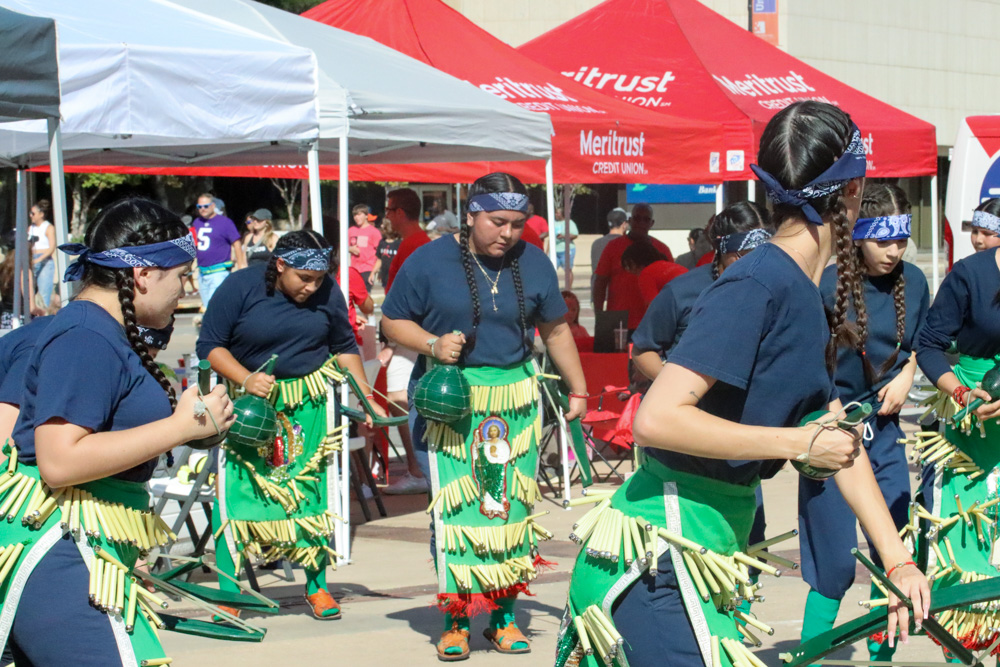 Performers perform cultural dance in front of Century II in downtown Wichita at ICT Open Streets. 