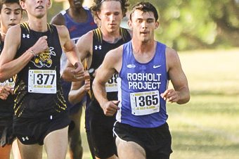 The men's cross country team sticks together through the beginning of the race at the JK Gold Classic on Sept. 11. The first place finisher was Adam Rzentkowski who ran unattached for Wichita State with a time of 18:09.3.