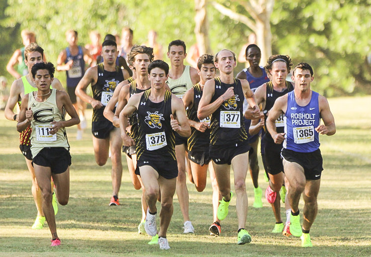 The mens cross country team sticks together through the beginning of the race at the JK Gold Classic on Sept. 11. The first place finisher was Adam Rzentkowski who ran unattached for Wichita State with a time of 18:09.3.